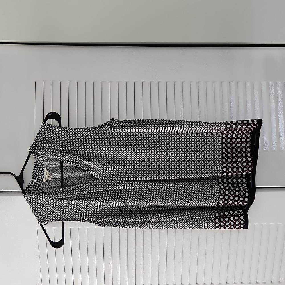 Sleeveless top black and white with red.